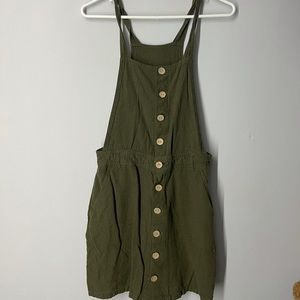 Garage green overall dress with pockets.